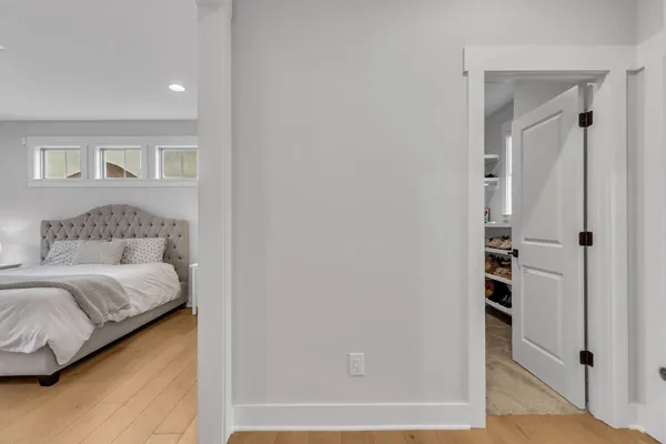 a bedroom with furniture and a window