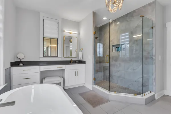 a bathroom with a shower and a glass door
