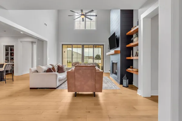 a living room with furniture and a fireplace