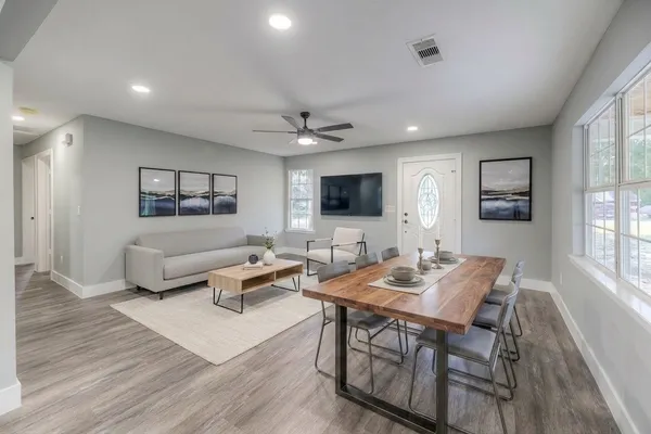 a living room with furniture and a flat screen tv
