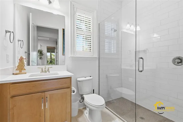a living room with furniture a wooden floor and a chandelier