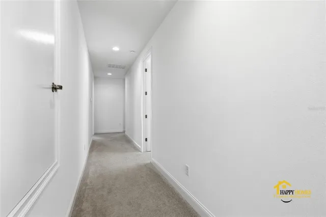 a spacious bedroom with a bed and window