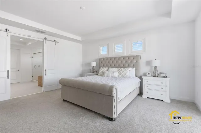 a spacious bathroom with a double vanity sink mirror and shower