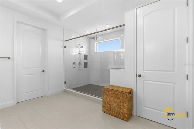 a bathroom with a shower and a sink