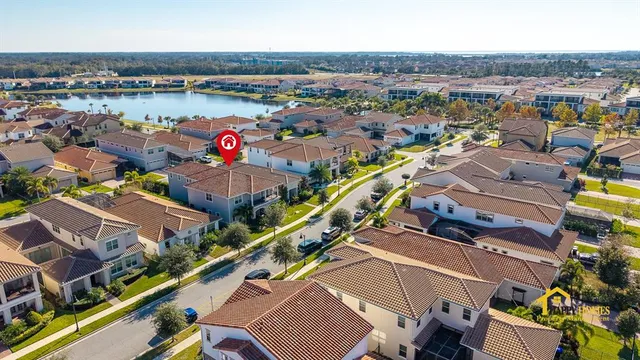 an aerial view of residential houses with outdoor space
