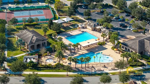 an aerial view of houses with yard