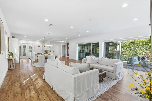 a kitchen with sink cabinets and wooden floor