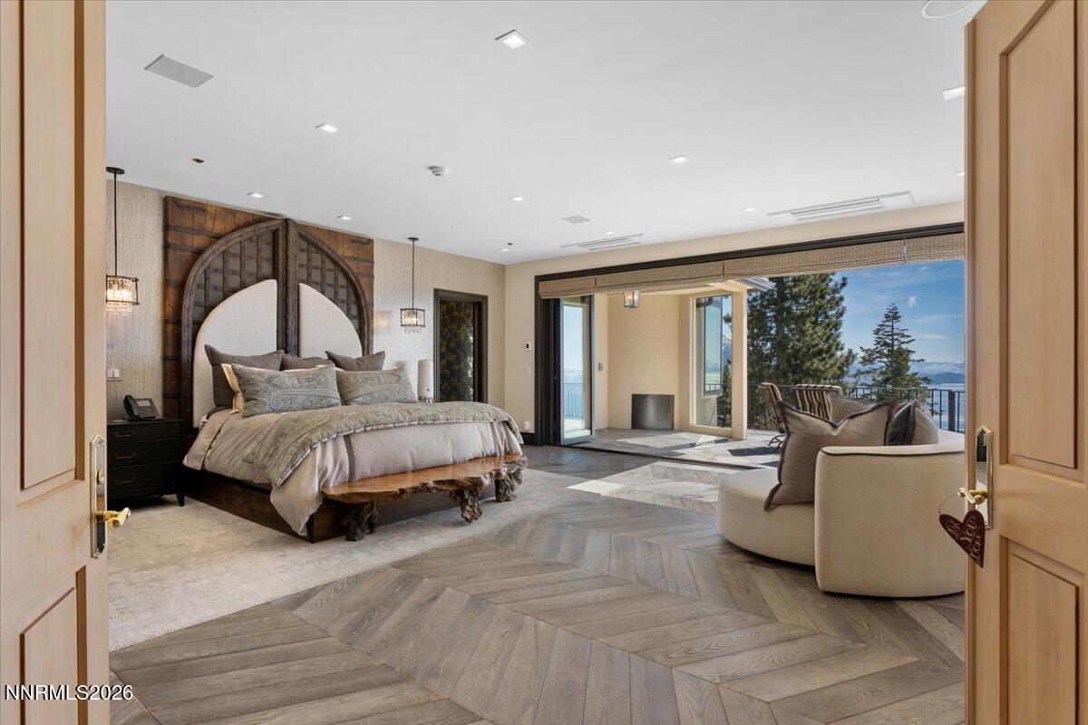 969 Fairview Boulevard Incline Village, NV 89451 - Photo 13 of 40 a spacious bedroom with a large bed and a large window
