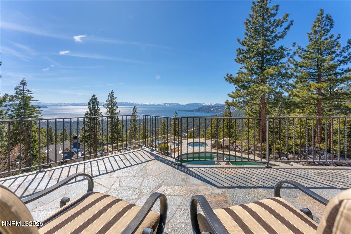969 Fairview Boulevard Incline Village, NV 89451 - Photo 15 of 40 a view of a roof deck with wooden fence and a couple of chairs