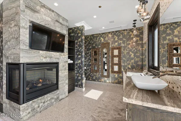 a bathroom with a bathtub and shower