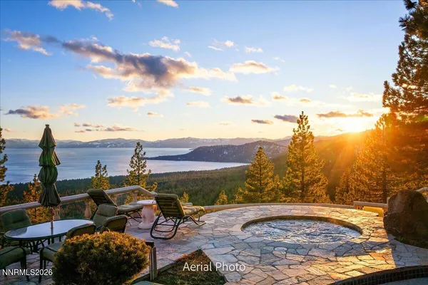 a view of a backyard with sitting area