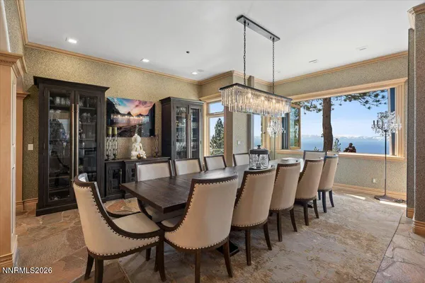 a kitchen with lots of counter top space and glass windows