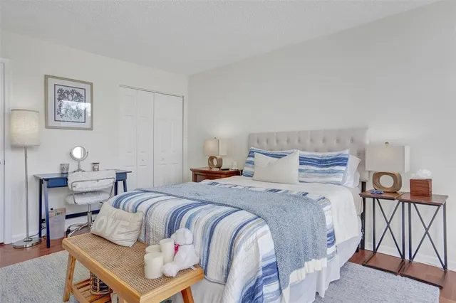 a bedroom with a bed and lamp