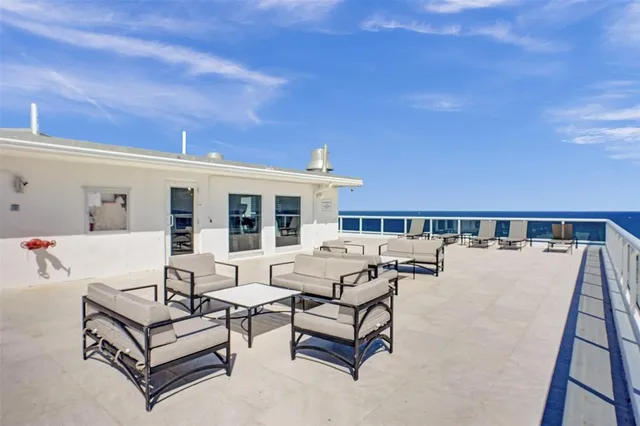 a view of a terrace with sitting area