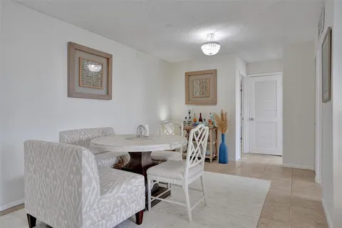 a view of a livingroom with furniture and a table