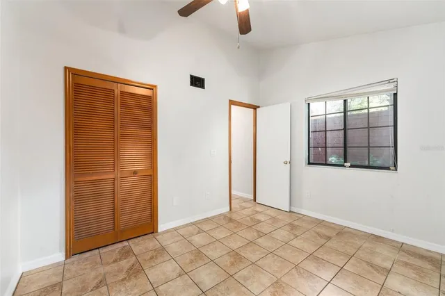 a bathroom with a sink a toilet and shower curtain