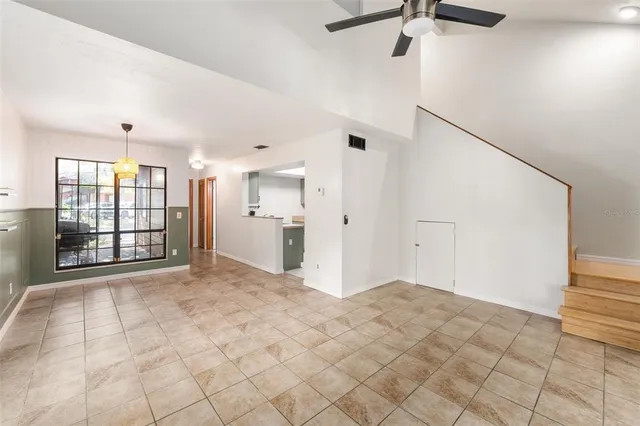 a view of a kitchen with refrigerator and a stove