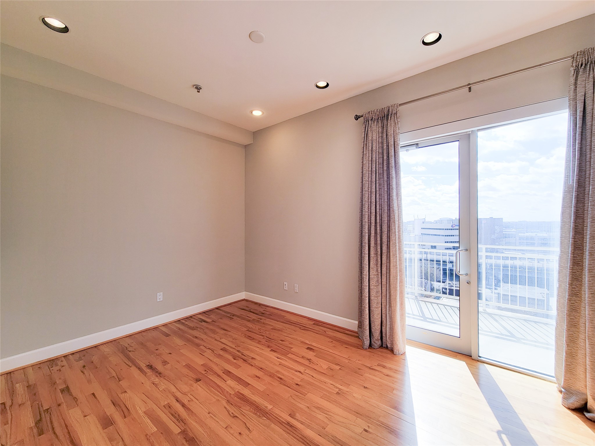 2520 Robinhood Street, Unit 800 Houston, TX 77005 - Photo 15 of 46 a view of an empty room with wooden floor and a window