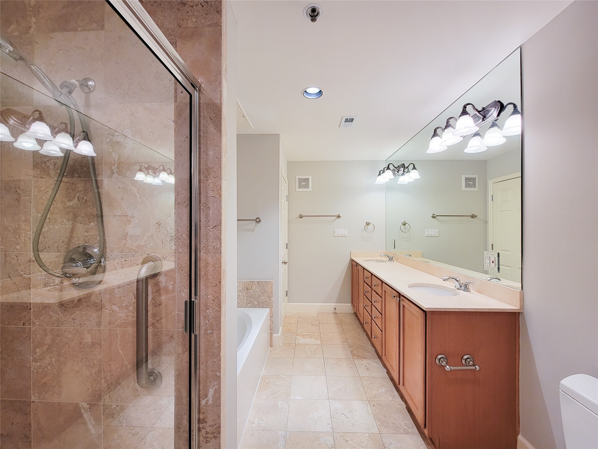 2520 Robinhood Street, Unit 800 Houston, TX 77005 - Photo 30 of 46 a bathroom with a double vanity sink and a mirror