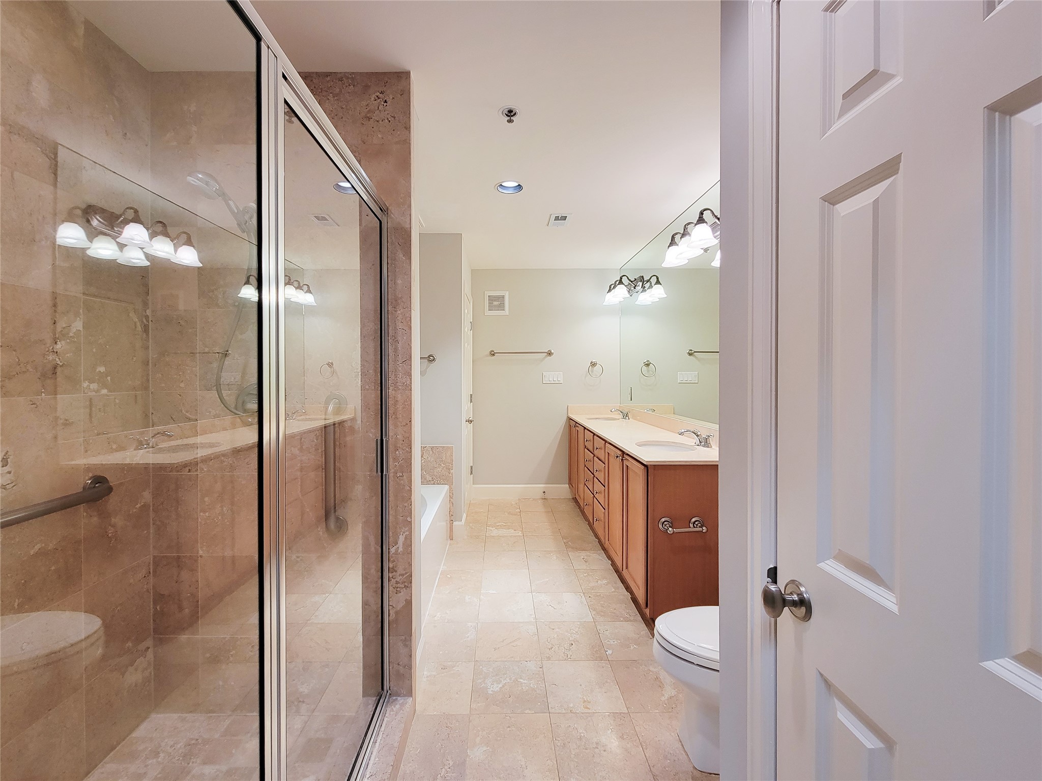 2520 Robinhood Street, Unit 800 Houston, TX 77005 - Photo 31 of 46 a bathroom with a sink a toilet and shower