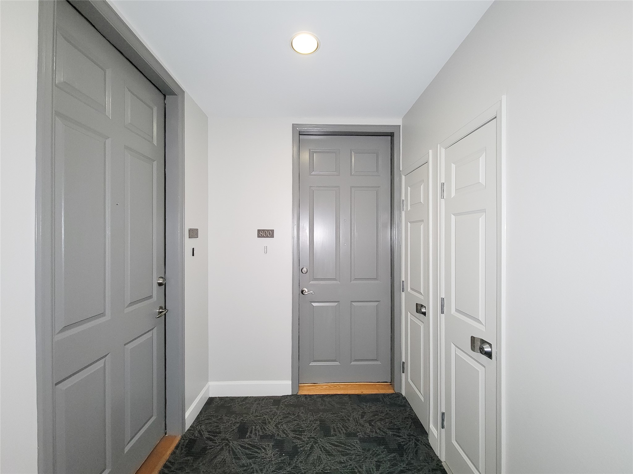 2520 Robinhood Street, Unit 800 Houston, TX 77005 - Photo 6 of 46 a view of a hallway with a wooden door