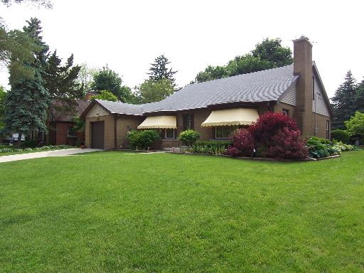 150 North Wolf Road Des Plaines, IL 60016 - Photo 1 of 16 a front view of a house with garden