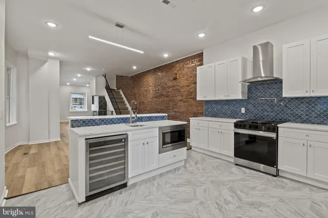 a kitchen with a stove and a sink