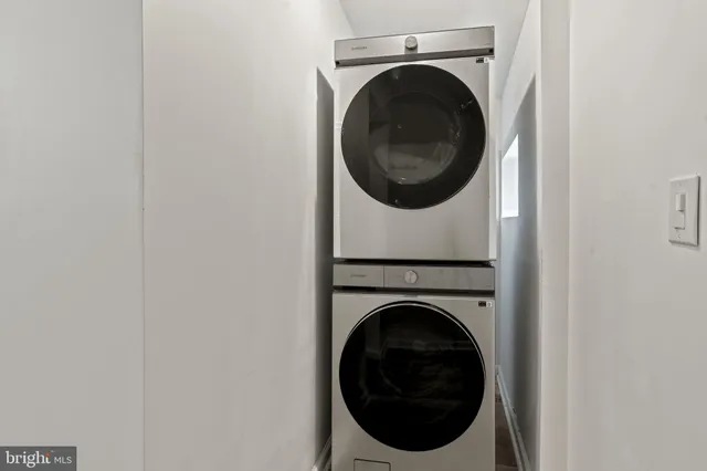 a view of a hallway with washer and dryer