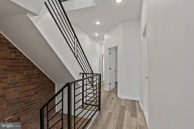 a view of entryway with wooden floor