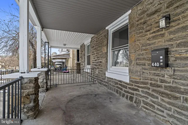 a view of a porch with wooden floor and fence