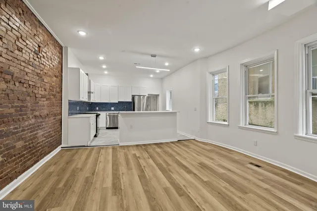 a view of kitchen with wooden floor