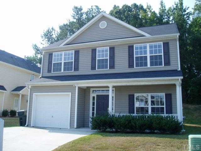 5904 Wynmore Road Raleigh, NC 27610 - Photo 1 of 10 a front view of a house with garden