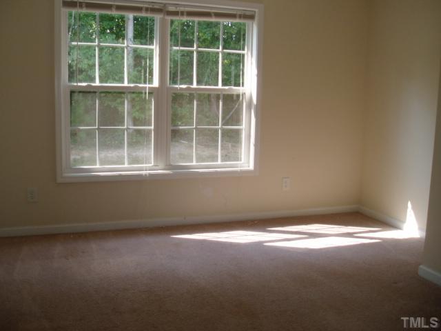 5904 Wynmore Road Raleigh, NC 27610 - Photo 6 of 10 a view of empty room with windows