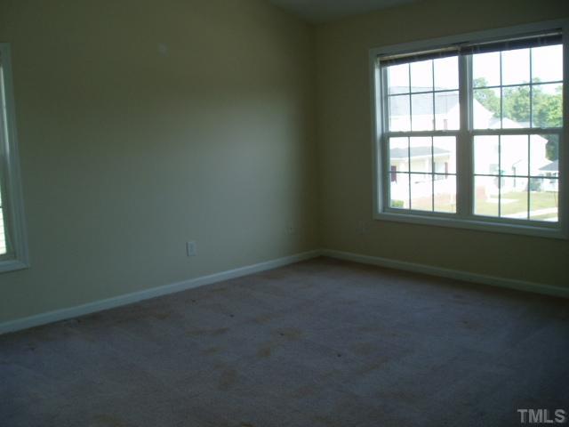 5904 Wynmore Road Raleigh, NC 27610 - Photo 8 of 10 an empty room with a window