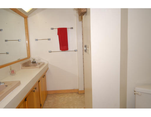 12 Tamarack Road Natick, MA 01760 - Photo 20 of 26 a bathroom with a sink vanity and a mirror