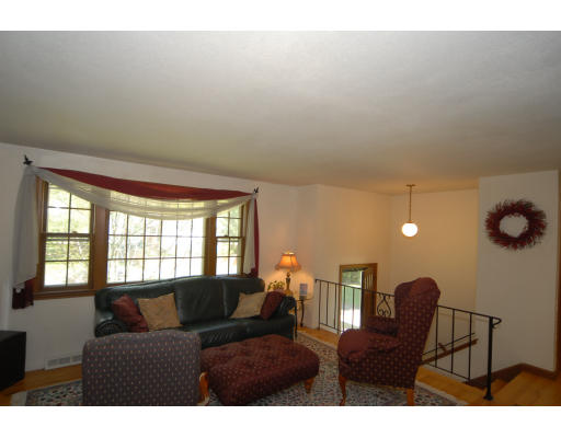 12 Tamarack Road Natick, MA 01760 - Photo 2 of 26 a living room with furniture and a window