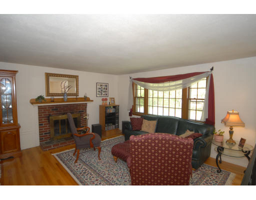 12 Tamarack Road Natick, MA 01760 - Photo 3 of 26 a living room with furniture and a fireplace