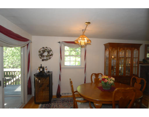 12 Tamarack Road Natick, MA 01760 - Photo 6 of 26 a living room with furniture and a chandelier