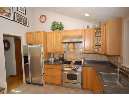 12 Tamarack Road Natick, MA 01760 - Photo 7 of 26 a kitchen with a refrigerator and a sink