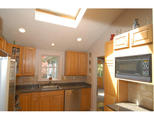 12 Tamarack Road Natick, MA 01760 - Photo 8 of 26 a bathroom with a sink a mirror and a bathtub