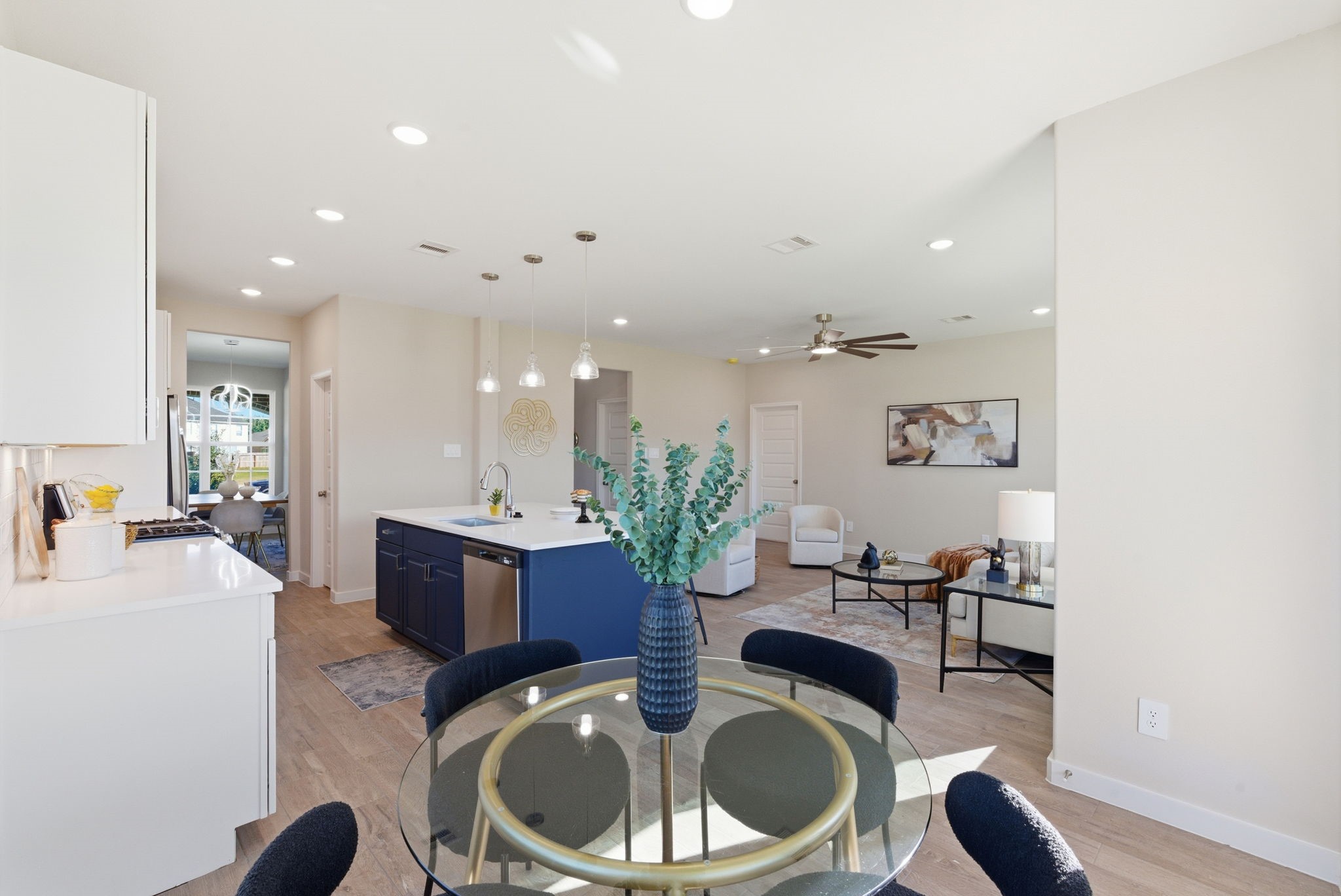 2443 Inlet Court Fresno, TX 77545 - Photo 20 of 50 a kitchen with a table and chairs
