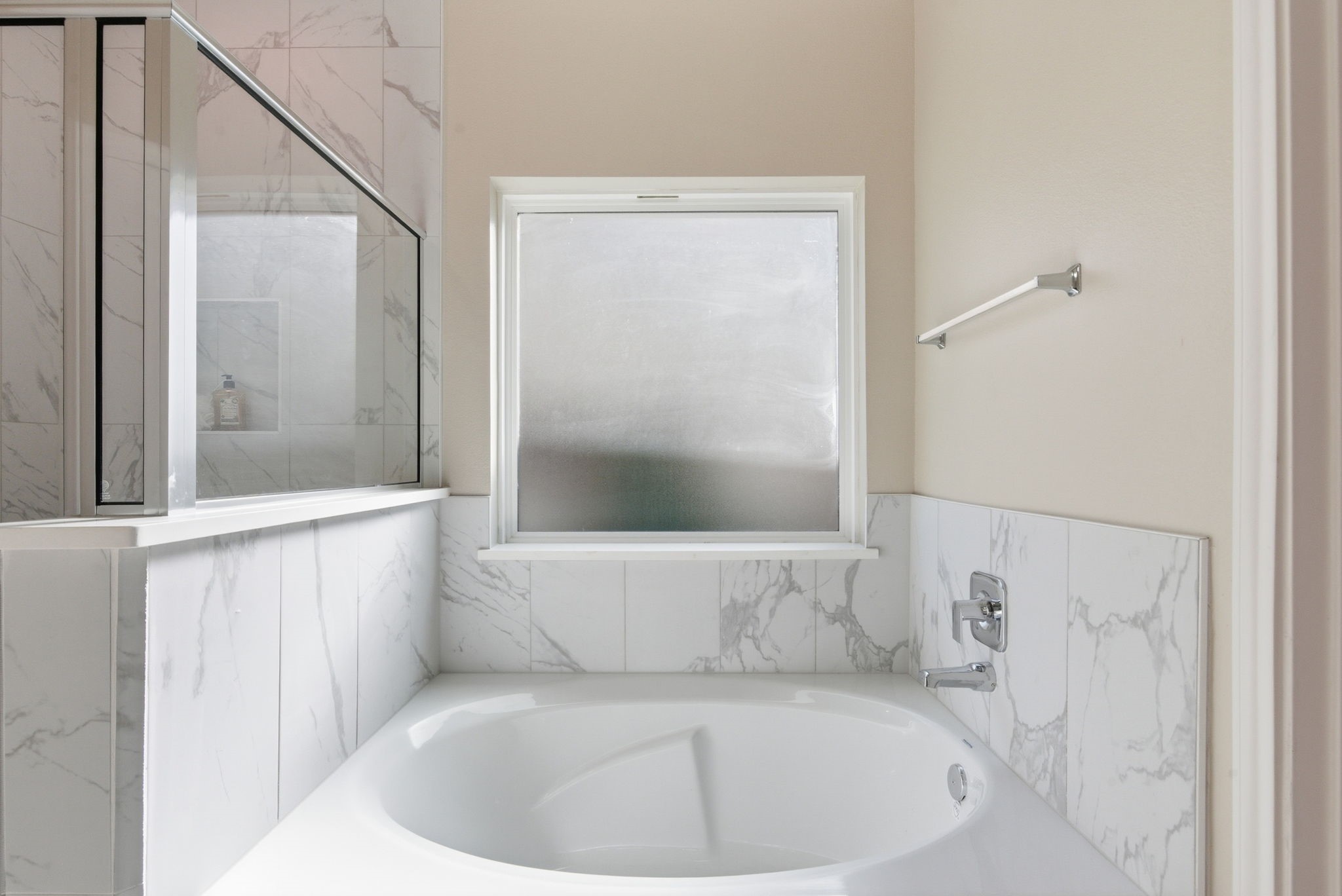 2443 Inlet Court Fresno, TX 77545 - Photo 27 of 50 a white bath tub sitting in a bathroom next to a window