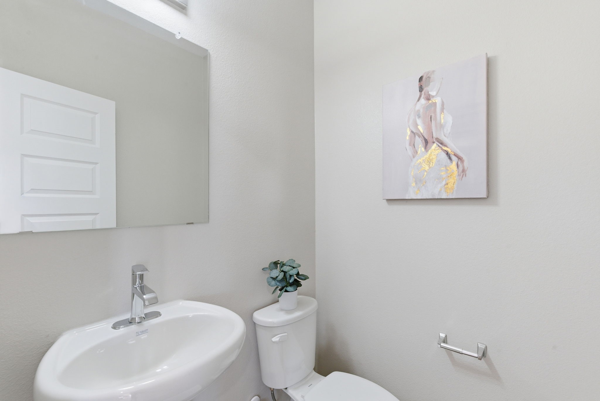 2443 Inlet Court Fresno, TX 77545 - Photo 30 of 50 a bathroom with a toilet a sink and mirror