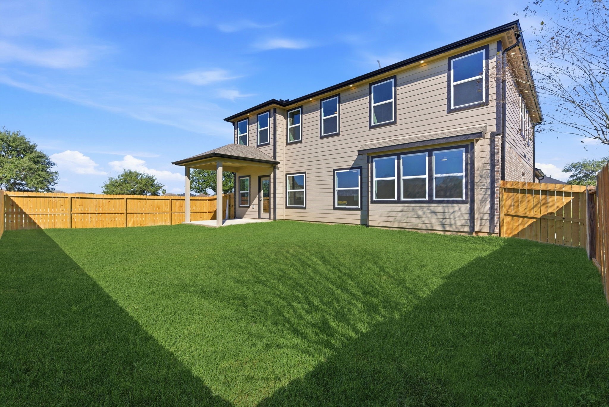 2443 Inlet Court Fresno, TX 77545 - Photo 48 of 50 a view of a house with a backyard