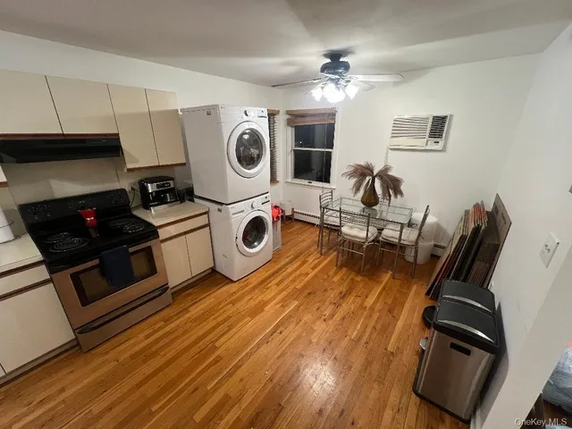 a utility room with dryer washer and fireplace