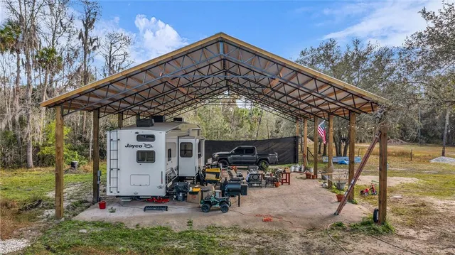a view of a chairs with table in the patio