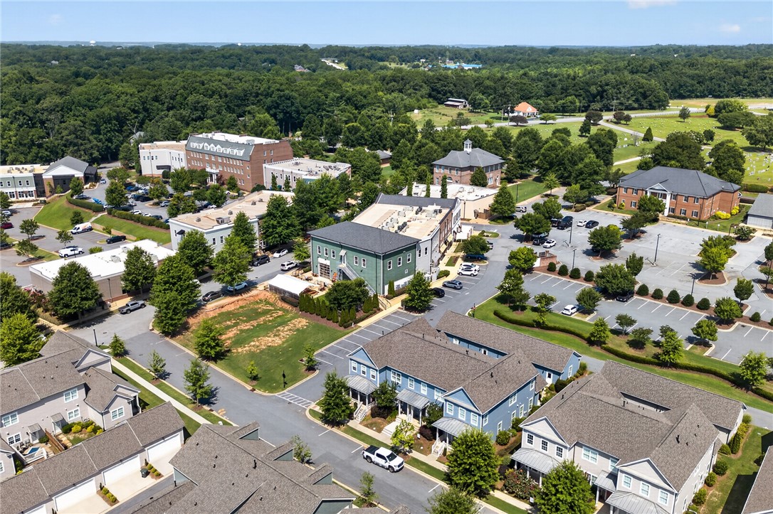 112 Tuttle Street Clemson, SC 29631 - Photo 33 of 46 An aerial perspective reveals a vibrant community with diverse architecture nestled amidst lush green landscapes.