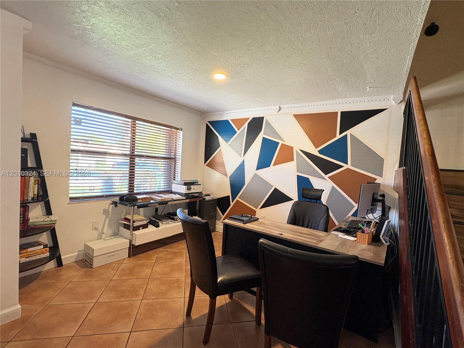 5424 Gate Lake Road, Unit 5424 Tamarac, FL 33319 - Photo 3 of 10 a living room with furniture and floor to ceiling windows
