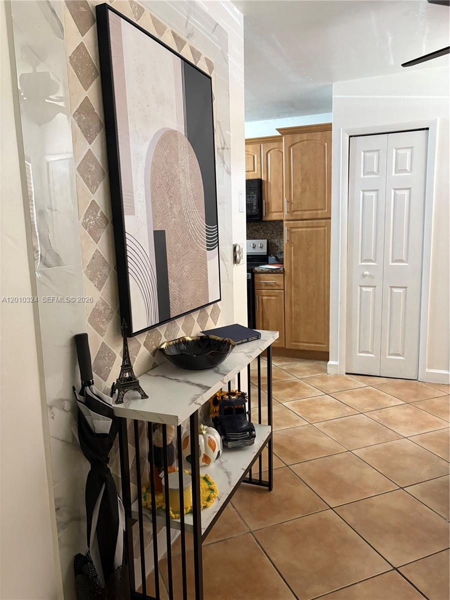 5424 Gate Lake Road, Unit 5424 Tamarac, FL 33319 - Photo 5 of 10 a view of a dining room with furniture and a kitchen