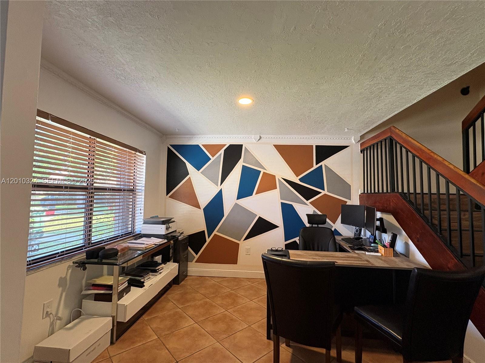 5424 Gate Lake Road, Unit 5424 Tamarac, FL 33319 - Photo 8 of 10 a dining room with furniture and a window
